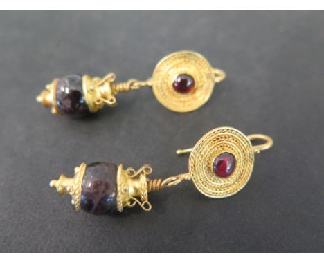 A pair of garnet ear pendants - Believed to be Roman 2nd 3rd AD fine gold - Length 5cms - Weight approx 16.1gms
Condition Rep