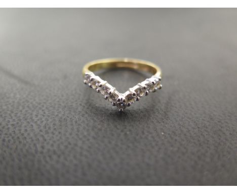 An 18ct gold brilliant-cut diamond wishbone ring - Hallmarked London - Ring size J 1/2 - Weight approx 2.8gms
Condition Repor