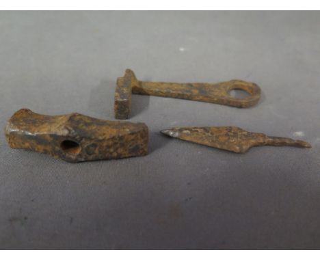An Ancient Roman iron key, arrow and jewelers hammer