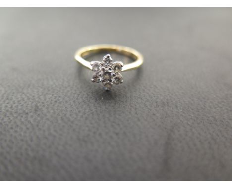 An 18ct gold brilliant-cut diamond daisy cluster ring - Estimated total diamond weight 0.50ct - Hallmarked London - Ring size