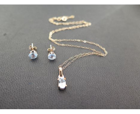 A blue-gem pendant - Possibly topaz - Suspended from a fine belcher-link chain - With marks indicating 9ct gold - Length of p