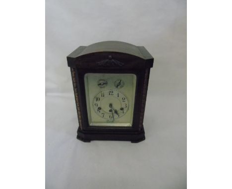 Oak cased mantle clock with continental movement