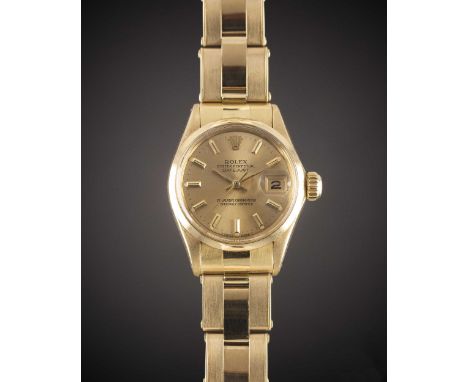 A LADIES 18K SOLID YELLOW GOLD ROLEX OYSTER PERPETUAL DATEJUST BRACELET WATCH
CIRCA 1968, REF. 6516 WITH CHAMPAGNE DIAL
Movem