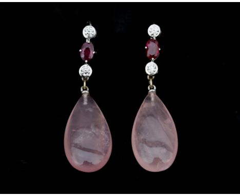 A pair of 18 karat white gold earrings set with cabochon cut rose quartz, each with an oval faceted cut ruby, approx. 0.80 ct