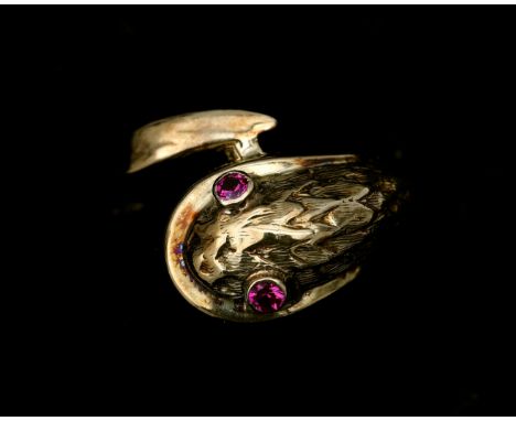 A 14 karat gold ring in the shape of a snake. The ring is set with two brilliant cut rubies for eyes. Gross weight: 4.9 g. Ri