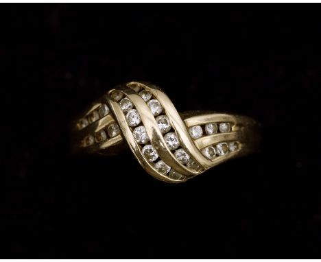 A 14 karat gold ring set with a brilliant cut diamonds. The ring is crafted in a braided pattern and contains twenty-six bril