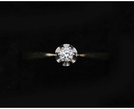 A 14 karat yellow with white gold solitaire ring set with a brilliant cut diamond approx. 0.10 ct. Color approx. G/H, clarity