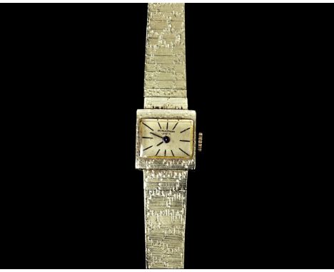 A 14 karat gold women's wristwatch by Baume &amp; Mercier, mechanical movement, ref. 39100. A rectangular case, gold-coloured