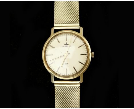 A 14 karat gold wristwatch of the brand Dugena. Movement: Mechanical (manual wind). Dial: champagne colored, gold colored str