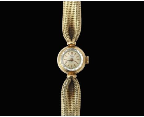 A 14 krt. gold Lotos women's wristwatch ca. 1960. A silver-coloured dial with batons, manual wind. Round case with integrated