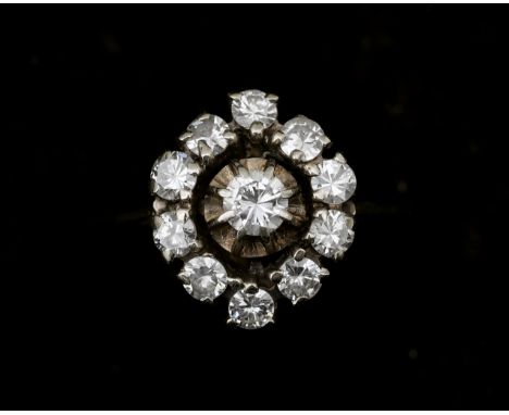 An 18 karat white entourage ring set with brilliant cut diamonds 1.12ct. The ring is is made in a Entourage shape with in the