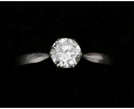 A 14 karat white gold solitaire ring, set with approx. 0.80ct. brilliant cut diamond. (a few small chips from the girdle) Car