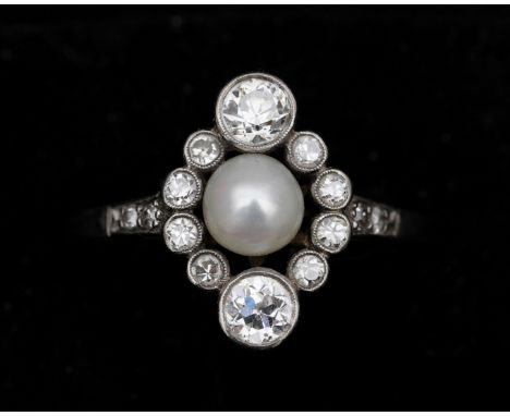 A 14 karat white gold ring set with a diamonds of approx. 0.55 ct and an Akoya pearl. The ring is made in Art Deco style, wit