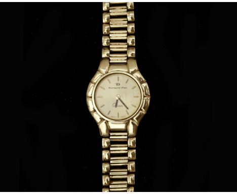 A ladies 14 karat gold wristwatch from the Bernard Piot brand. Movement: Quartz. Dial: gold-coloured, gold-coloured stripes a