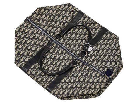 Circa 1970s Blue Christian Dior Monogrammed Overnight Bag, with blue leather straps and handles, cream canvas lining and atta