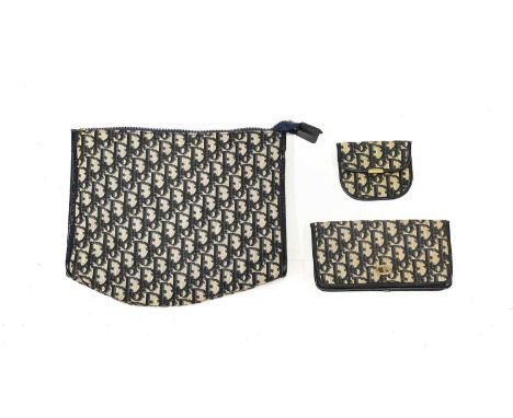 Circa 1970s Christian Dior Blue Monogrammed Wash Bag with zip fastening, 29cm by 25cm;  Matching Purse of rectangular shape w