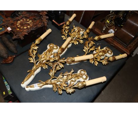 Two pairs of brass twin branch wall light fittings 