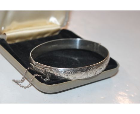 A Harrods 1963 Birmingham solid sterling silver bangle, approx. 27gms