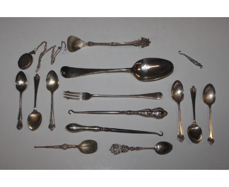 A silver pickle fork; a collection of various silver spoons, approx. total weight 165gms; various white metal spoons; two sil