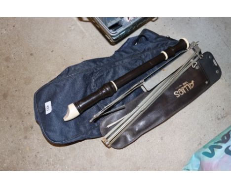 A recorder, sheet music stand and carry bag