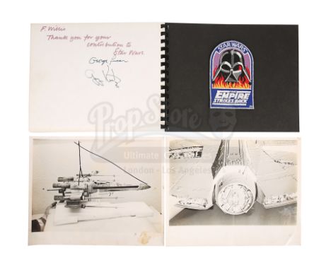 An autographed crew photo book, two workshop stills and a crew patch from the production of George Lucas'' Star Wars: A New H