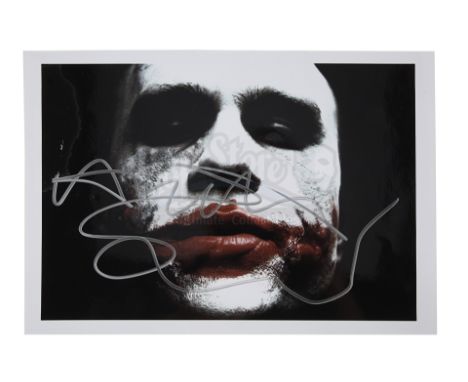 A photo signed by Heath Ledger from the promotion of Christopher Nolan's action-thriller sequel The Dark Knight. The colour p