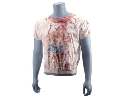 Tyler Durden's (Brad Pitt) screen-matched bloodied "Sock it to Me" shirt from David Fincher's black comedy Fight Club. The sh