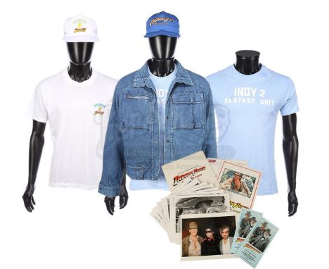 A set of crew items from the production of Steven Spielberg's first three Indiana Jones films. The lot consists of a denim ja