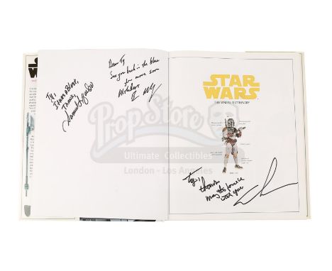 A copy of Star Wars: The Visual Dictionary autographed by three main cast members of George Lucas' Star Wars prequel trilogy.
