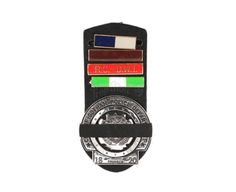 A Gotham City Police badge with mourning band and ranking bars from Christopher Nolan's action-thriller sequel The Dark Knigh