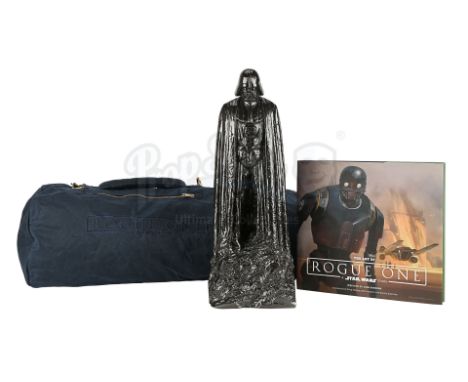 A Darth Vader crew gift statue, bag and art book from the production of Gareth Edwards' Star Wars prequel Rogue One: A Star W