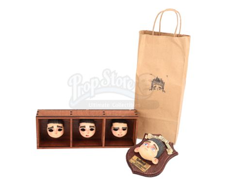A set of Norman Babcock stop-motion faces, crew gifts, gift box and bag from Chris Butler and Sam Fell's stop-motion comedy h