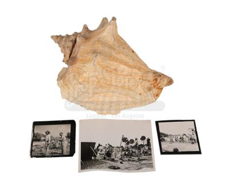 Honey Ryder's (Ursula Andress) conch shell and a set of black-and-white photographs from the production of Terence Young's Bo