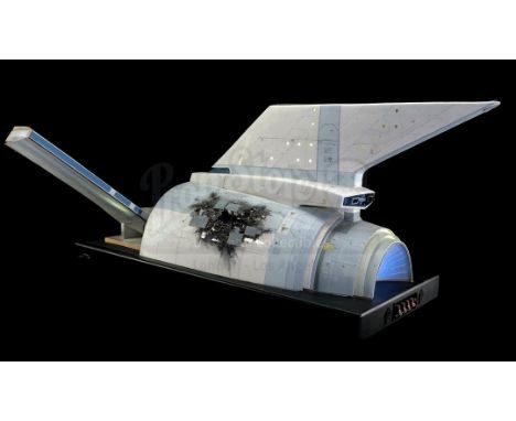 A screen-matched, light-up, battle-damaged USS Enterprise hull insert section model miniature display from Nicholas Meyer's S