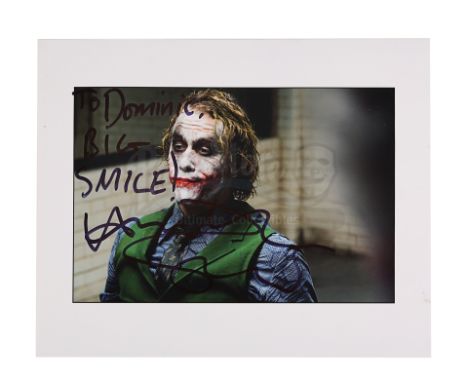 A still autographed by Heath Ledger from the promotion of Christopher Nolan's action-thriller sequel The Dark Knight. The col
