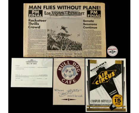 A Bulldog Cafe menu, a "Rocketeer Thrills Crowd" newspaper, and Bigelow's Air Circus memorabilia from Joe Johnston's superher