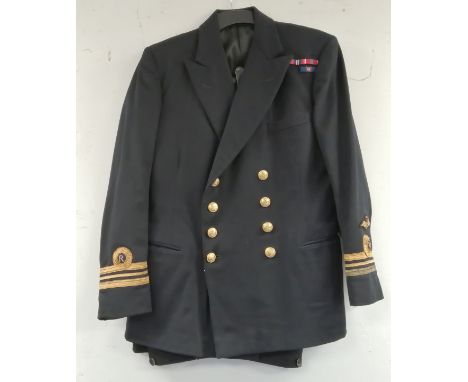 British Royal Navy dress uniform jacket having Moss Bros &amp; Co Ltd of London label, brass naval buttons by Pitt &amp; Co, 