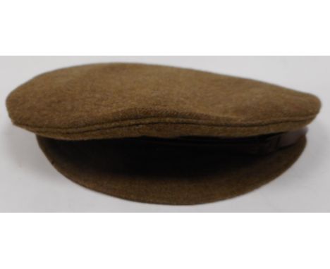 WW I army khaki cap. With G.S. chinstrap buttons, Appears un-used but grubby. Some moth. No badge piercing.