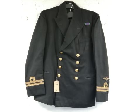 British Royal Navy dress uniform jacket having C H Bernard &amp; Sons Ltd of Harwick Essex interior pocket label "R M Thirde 