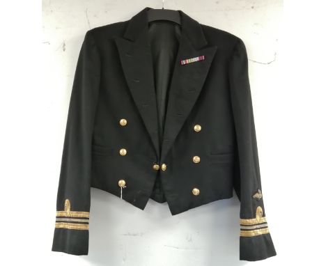 British Royal Navy dress uniform jacket having Gieves Ltd interior pocket label, Gieves brass naval buttons, bullion wire cuf