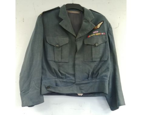 British Royal Air Force dress uniform jacket having RAF buttons, epaulette rank band for the rank of Flight Lieutenant, N (na