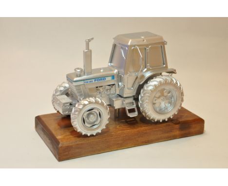 Unique and Bespoke Britains 1/32 Ford TW20 Tractor mounted on a plinth. Finished in Matt Silver. One Only. 