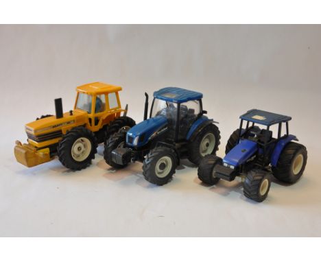 Unboxed Tractor models including Britains County 1884 in Yellow plus two others. Good to Excellent. (3)