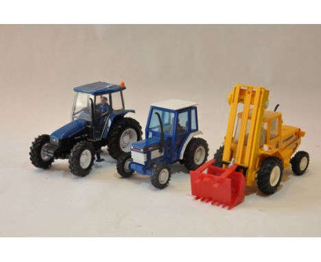 Britains loose tractor models including New Holland TL80 and others. Good to Excellent. (3)