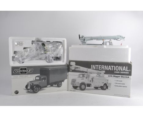 First Gear 1/34 Scale International 4400 Truck with Digger Derrick plus Chevrolet 1937 Freight Truck. Near Mint in Boxes. (2)