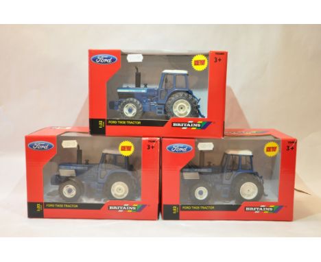 Britains 1/32 Tractor trio comprising Ford TW25, TW30 and TW35. Mint in Boxes. (3)