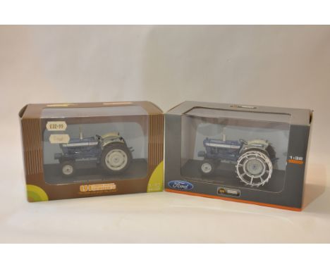 Universal Hobbies 1/32 Ford 5000 plus Ford 5000 with cage wheels Tractor models. Mint in Boxes. (2)