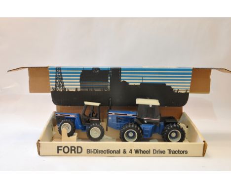 Scale Models 1/32 Ford Versatile Bi-directional and 4WD tractor Set. Excellent with box.