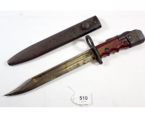 A British Army land services bayonet No.7 MK1/L 1948 with brown paxolin grip in steel scabbard, blade 20.5cm long 