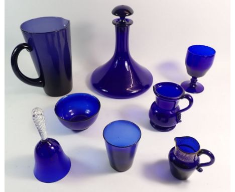 A collection of Bristol blue glass comprising eight pieces: large jug, ships decanter, small sided jug, jug, bowl, goblet, tu